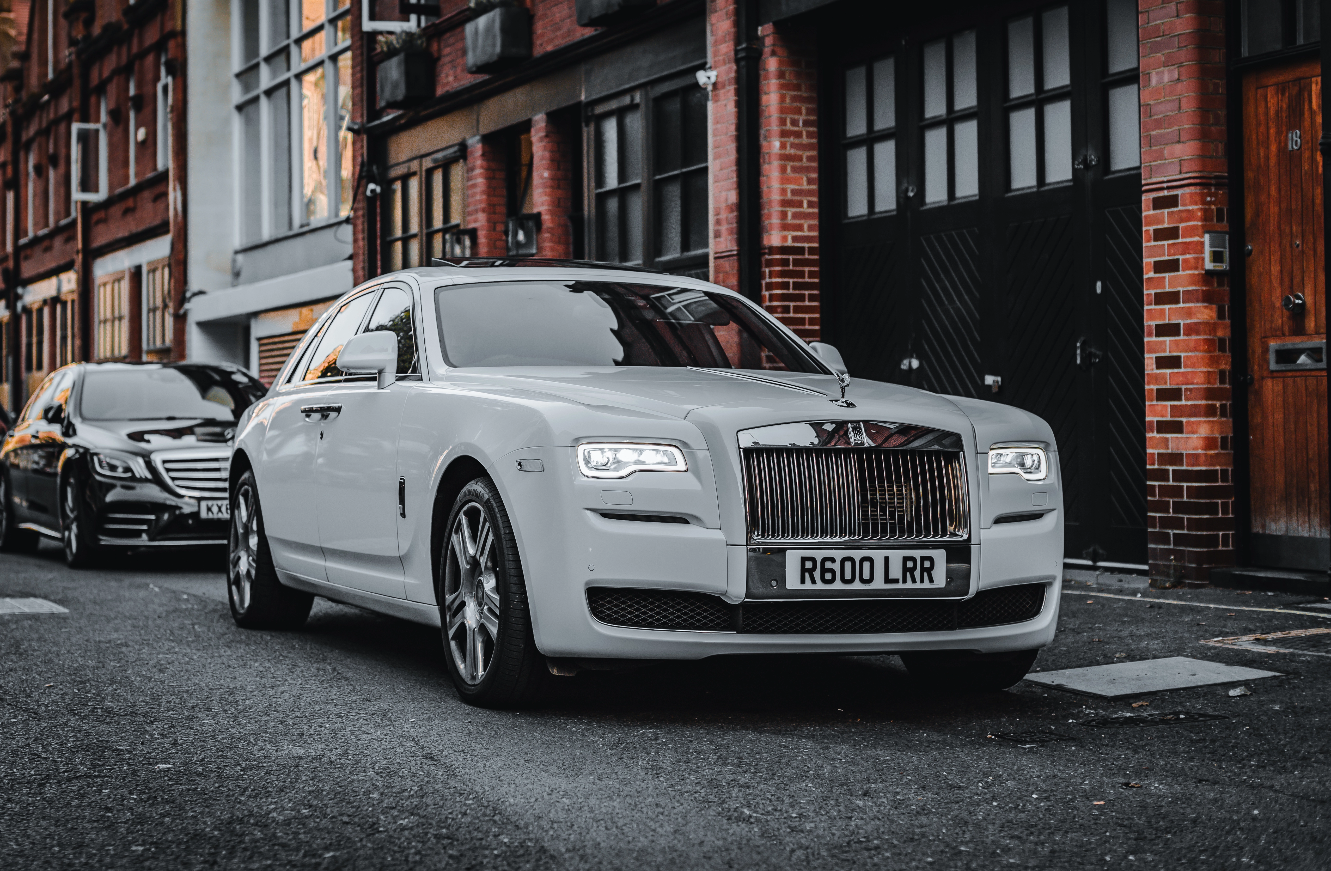 A modern roll-royce posing in the center of the image