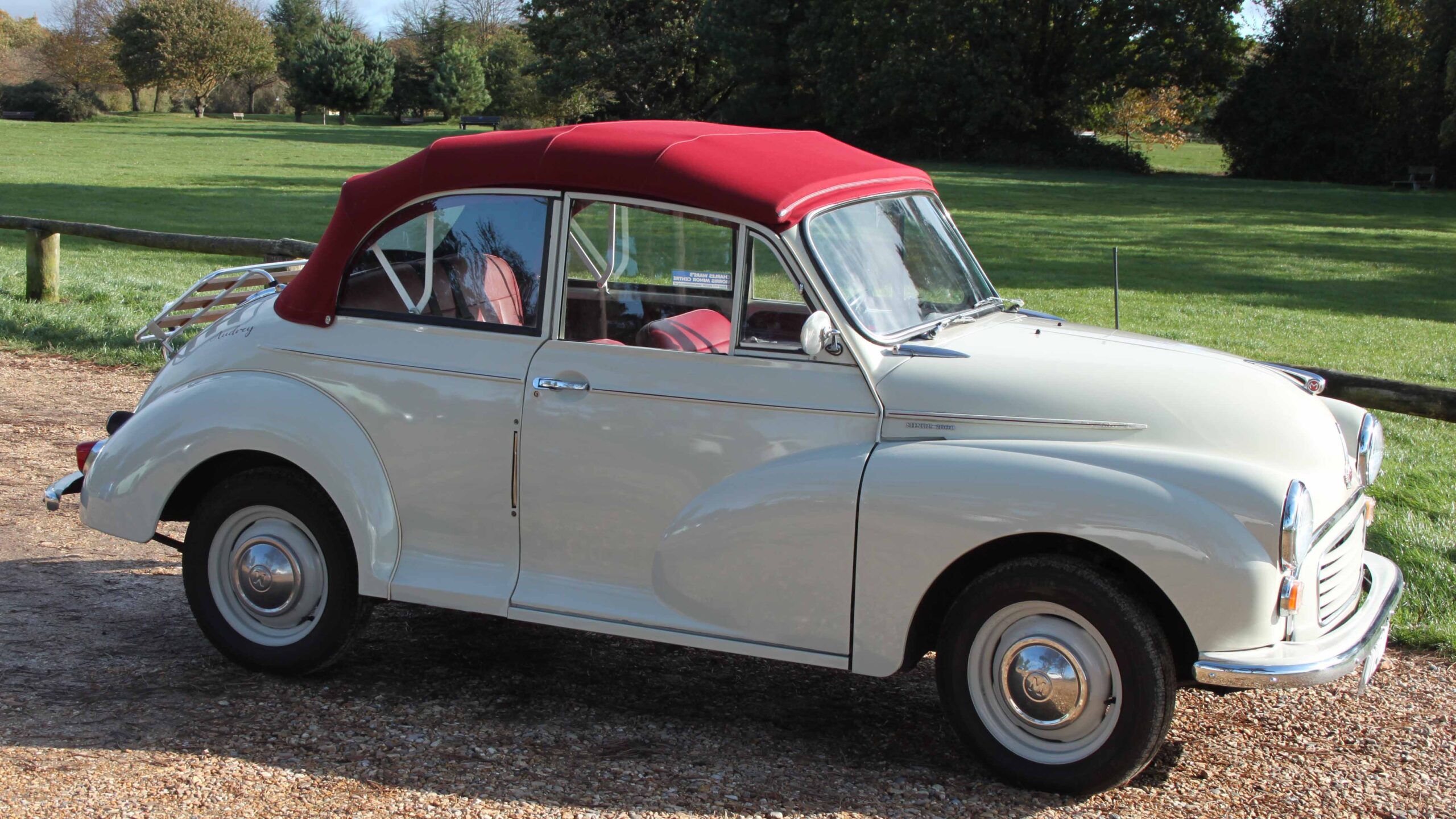 Morris Minor with burgundy roof up