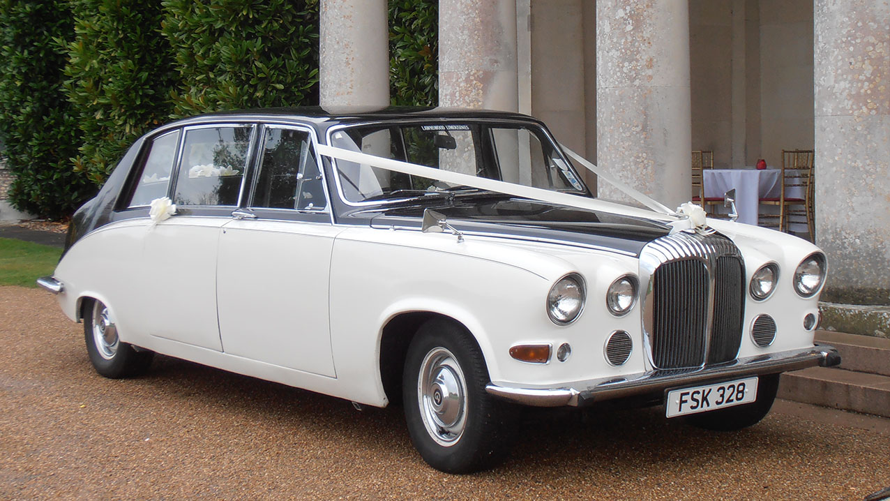 7-seater Classic Daimler in front of wedding venue with Wedding decoration