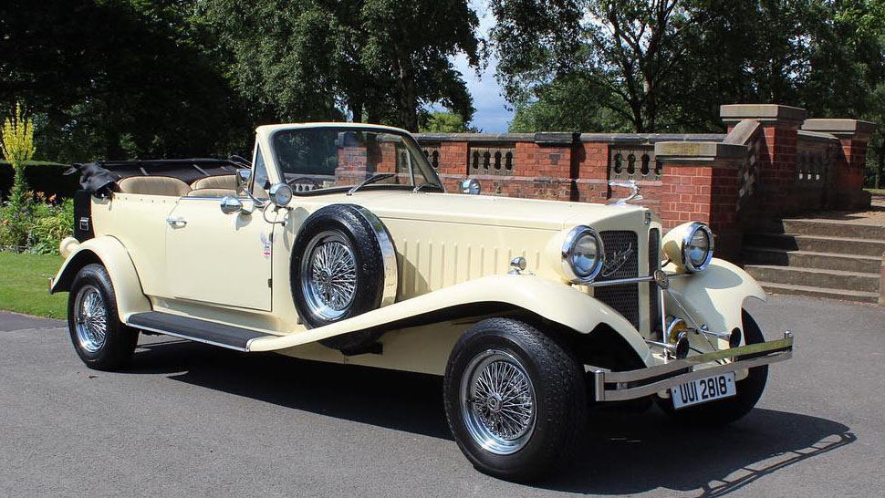 Ivory Vintage Style Beauford waiting for couple outside their venue