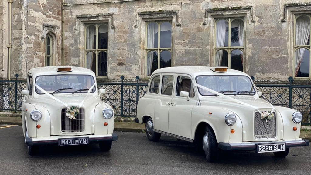 Pair of Classic London Taxi waiting for Bride and Groom in London