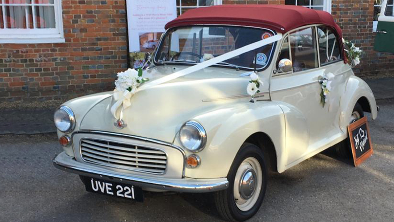 Morris Minor front side view with traditional white ribbons