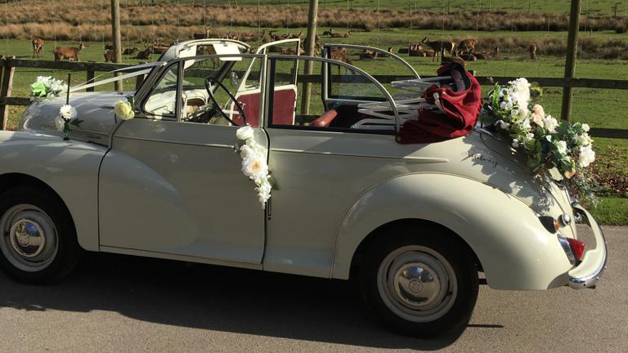Morris Minor side view with roof down and flower decoration