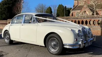 Side view of classic car photo in front of Church