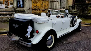 Rear view photo taken of Beauford with roof down showing the black picnic trunk at the rear