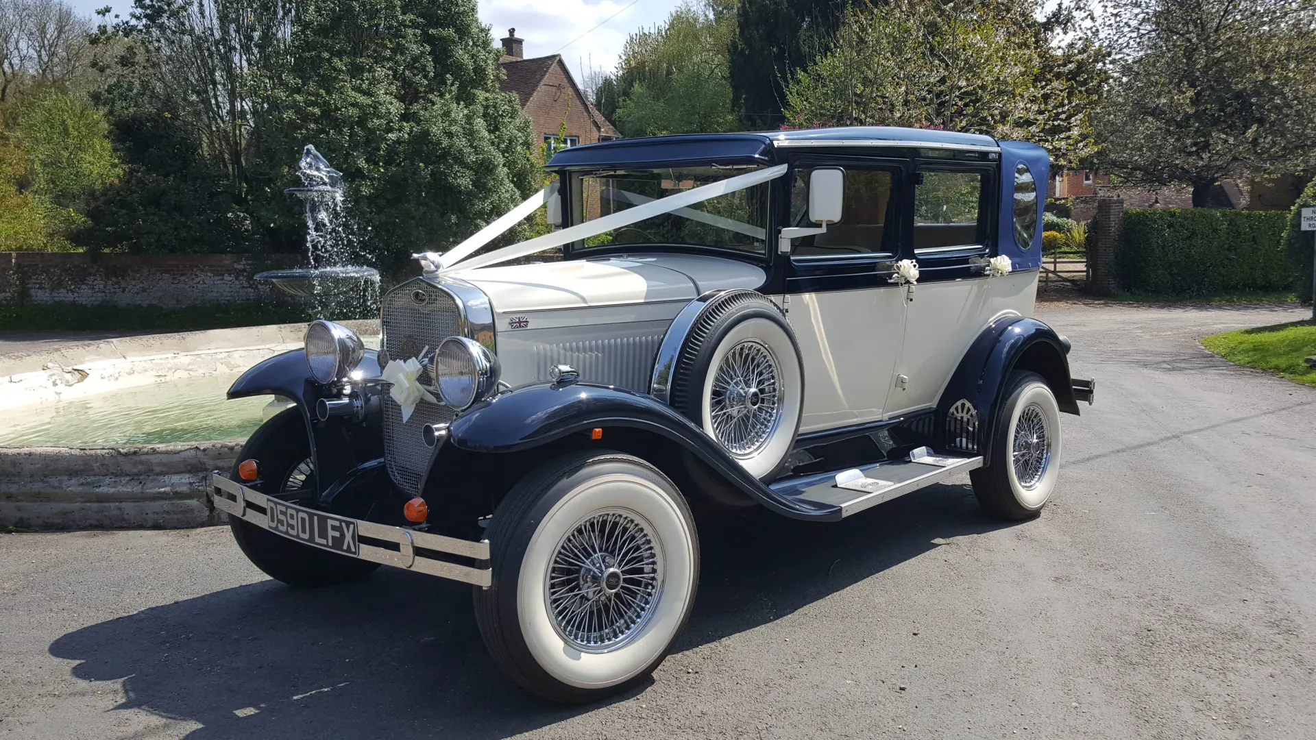 Blue & White 1930's Vintage Style Badsworth waiting at wedding venue. Decorated with White ribbons