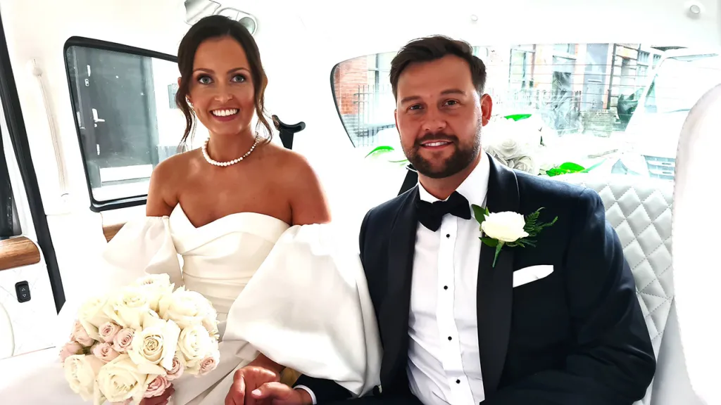 Bride and Groom inside Modern Taxi Cab
