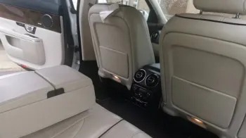 Rear Interior showing the cream leather, middle armrest and plenty of legroom