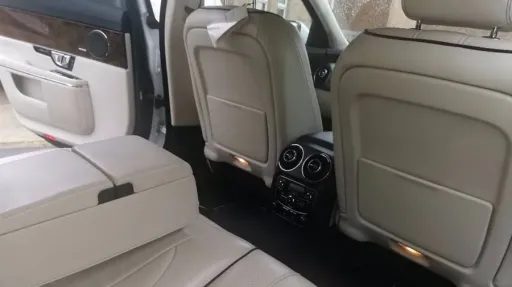 Rear Interior showing the cream leather, middle armrest and plenty of legroom