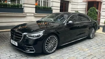 Side View of Black Mercedes showing the large Silver Chrome Alloy wheels
