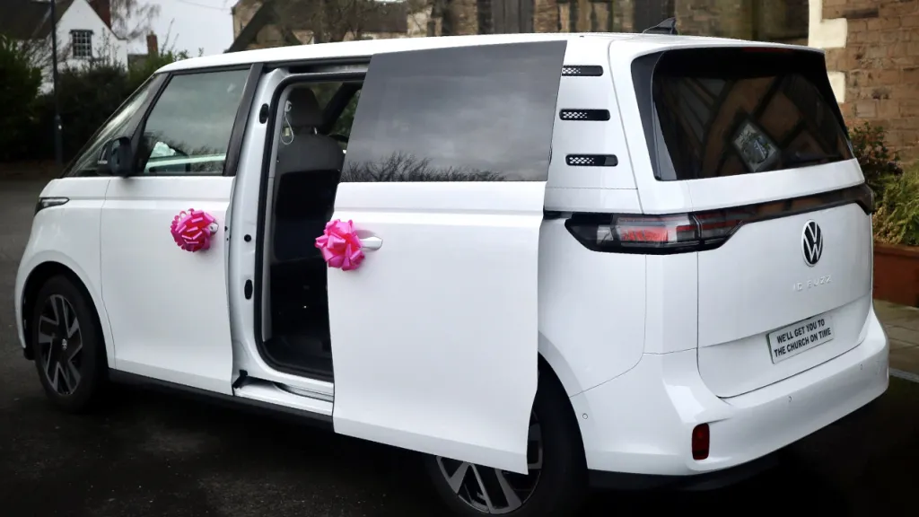 Rear side view with rear sliding door open showing the large door entrance