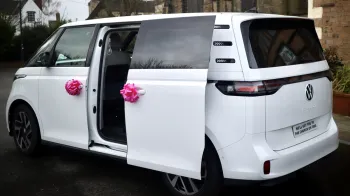 Rear side view with rear sliding door open showing the large door entrance
