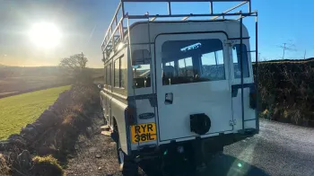 Rear of Classic land Rover showing lare access door to rear seating area