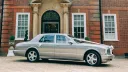 Side view of Bentley Arnage dressed with white ribbons accross the bonnet and bows on rear door handle