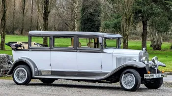 Right side of bramwith convertible showing the two-tone bronze exterior colour and roof down with white wall tires