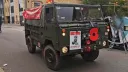 Front view of Classic austin Champ decorated with white wedding ribbons and UK flag  at rear of the vehicle