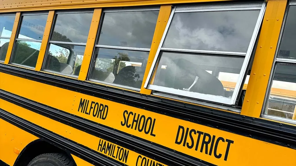 Close up to the Yellow American Bus signs