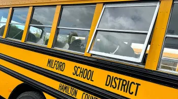 Close up to the Yellow American Bus signs
