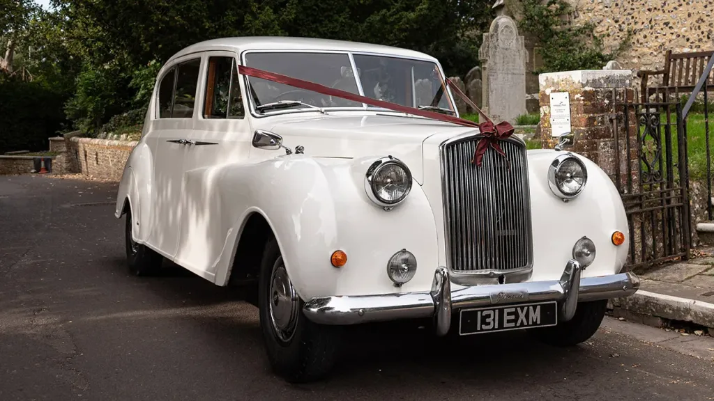 Front side view of Ivory Classic Austin Princess decorated with Burgundy Ribbons