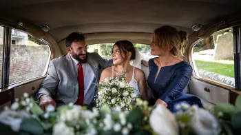 Interior photo with 3 adults seating inside