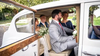 Rear seating showing 4 grown adults seating in the rear cabin with the casual seats up