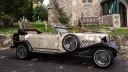 Side view of Ivopry Beauford dressed with Burgundy Ribbons in Front of a church