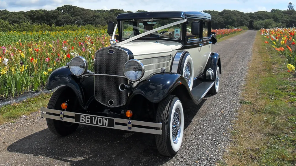 Front view of Vintage Branford decorated with white ribbon, chrome grill and old fashion headlights