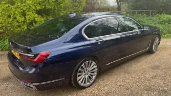 side rear view of dark blue BMW wedding car