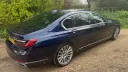side rear view of dark blue BMW wedding car
