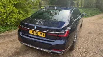 rear view dark blue 7-series bmw