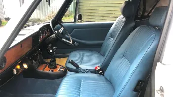 Front seats in a Classic Triumph Stag with wooden dashboard