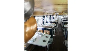 Interior seats with bench and table decorated with balloons