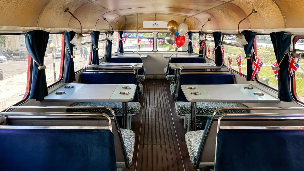 interior view of blue bench facing each others with table in the middle
