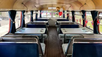 interior view of blue bench facing each others with table in the middle