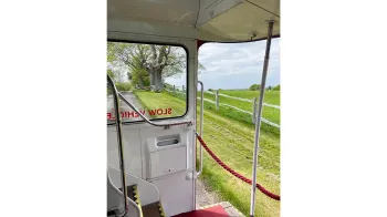 looking out through the rear open platform from the lower deck