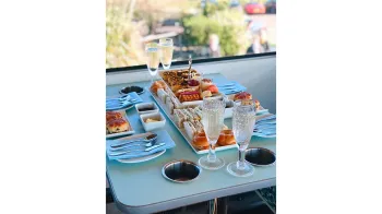 Table set for Afternoon Tea in the Routemaster bus.