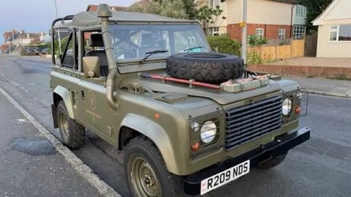 Military Landrover side view without any wedding decoration