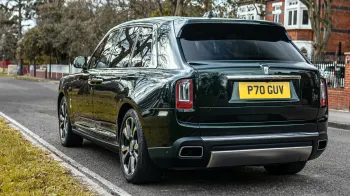 Rear Left View of Dark Green Rollslls-Royce Cullinan