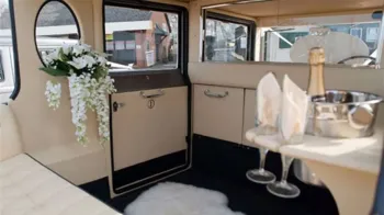 Cream interior inside the Bramwith, wedding flower decoration and champagne flute