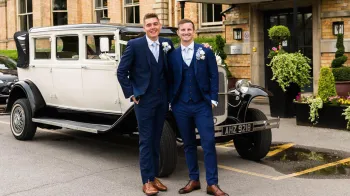 Two Grooms standing in front of the Bramwith Convertible