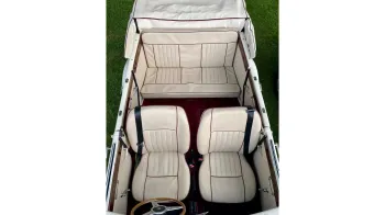 interior of a Convertible Beauford showing Cream Leather interior and Burgundy Carpet.