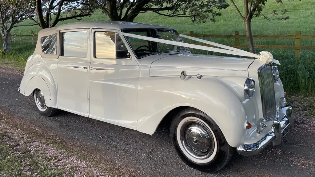 Side view of classic austin Princess Convertible showing the closed up cream soft-top roof