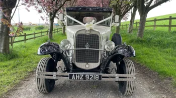 Full front view of Vintage Bramwith dressed with ivory Ribbon, Black Roof and Black Wheel Arches