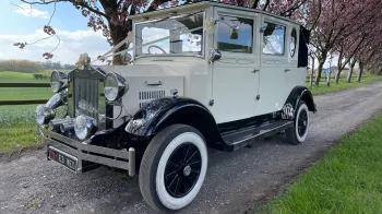 Side View of a vintage Bramwith dressed with Ivory Ribbons accross its bonnet