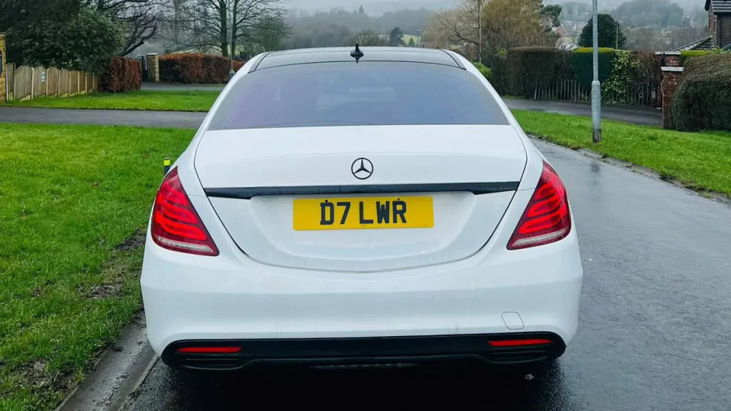 Full Rear View of White Mercedes