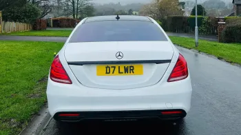 Full Rear View of White Mercedes