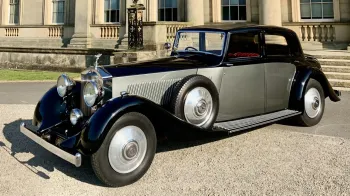 Rolls-Royce Phantom II Continental LWB in Black and Grey in front of a wedding venue