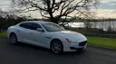 Front right side of white maserati