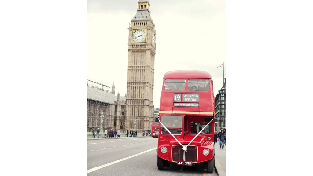 Front view of Routemaster bsu with white ribbon and Elizabeth's Tower in the Background