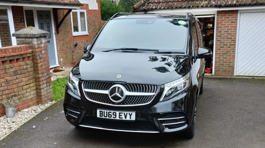 Black Mercedes V-Class parked on a driveway